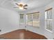 Bright breakfast area with wood-look tile floors and large windows at 93 Lakesprings Dr, Mcdonough, GA 30252