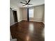 Spacious bedroom featuring hardwood floors and a ceiling fan at 59 S Old Highway 27, Roopville, GA 30170