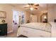 Main bedroom with ceiling fan and access to another room at 417 Foggy Bottom Dr, Carrollton, GA 30116