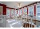 Sunroom with white wicker furniture and plenty of natural light at 417 Foggy Bottom Dr, Carrollton, GA 30116