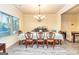 Formal dining room with chandelier and hardwood floors at 9046 Holder Rd, Locust Grove, GA 30248