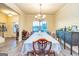 Bright dining room featuring a large table and sideboard at 9046 Holder Rd, Locust Grove, GA 30248