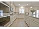 Modern kitchen with stainless steel appliances and hardwood floors at 371 Caledonia N Ct, Peachtree City, GA 30269