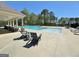 Relaxing pool area with plenty of lounge chairs at 371 Caledonia Ct N, Peachtree City, GA 30269