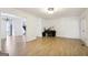 Open-concept living area showcases hardwood floors, with views into other rooms at 3863 Meeting St, Duluth, GA 30096