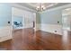 Formal dining room with hardwood floors, wainscoting, and neutral color scheme at 7770 Stratford Manor Ln, Sandy Springs, GA 30350