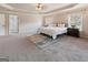 Large main bedroom with plush carpeting and ample natural light at 7770 Stratford Manor Ln, Sandy Springs, GA 30350