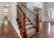 Elegant staircase with hardwood treads and iron balusters at 7770 Stratford Manor Ln, Sandy Springs, GA 30350