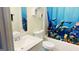 Bathroom with a shower/tub combo, sink, and ocean-themed curtain at 219 Chipley Creek Dr, Villa Rica, GA 30180