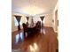 Formal dining room with hardwood floors and a chandelier at 787 Pine Needle Rd, Hampton, GA 30228