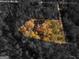 Aerial view of house nestled in a wooded area at 668 Keys Ferry Rd, Mcdonough, GA 30252