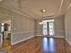 Spacious dining room with hardwood floors and kitchen view at 3239 Talimore Cir, Marietta, GA 30066