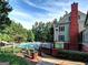 Community pool with surrounding deck and clubhouse at 3239 Talimore Cir, Marietta, GA 30066