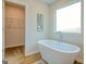 Bathroom with a free-standing tub and closet at 205 Weldon Rd # 44, Mcdonough, GA 30253
