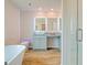 Bathroom with a freestanding bathtub and a walk-in shower at 205 Weldon Rd # 44, Mcdonough, GA 30253