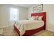 Bedroom with red upholstered bed and patterned bedding at 205 Weldon Rd # 44, Mcdonough, GA 30253