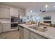 Kitchen island with granite countertop, sink, and seating for two at 205 Weldon Rd # 44, Mcdonough, GA 30253