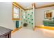 Bathroom with teal tile shower and floating vanity at 242 Kirkley Rd, Tyrone, GA 30290