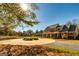 Two-story home with circular driveway and landscaping at 242 Kirkley Rd, Tyrone, GA 30290
