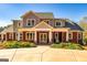 Two-story home with a covered porch and copper roof at 242 Kirkley Rd, Tyrone, GA 30290