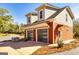 Detached garage with two garage doors and a second-story room at 242 Kirkley Rd, Tyrone, GA 30290