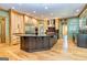 Spacious kitchen with an expansive island and dark wood cabinetry at 242 Kirkley Rd, Tyrone, GA 30290