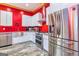 Modern kitchen with stainless steel appliances and red walls at 242 Kirkley Rd, Tyrone, GA 30290