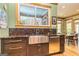Modern farmhouse kitchen with a farmhouse sink and stainless steel appliances at 242 Kirkley Rd, Tyrone, GA 30290