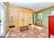 Laundry room with custom cabinetry and tile flooring at 242 Kirkley Rd, Tyrone, GA 30290