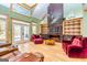 Spacious living room with a large marble fireplace and hardwood floors at 242 Kirkley Rd, Tyrone, GA 30290