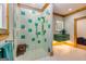 Large walk-in shower with teal tile detail at 242 Kirkley Rd, Tyrone, GA 30290