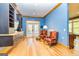 Sitting area with hardwood floors and built-in shelving at 242 Kirkley Rd, Tyrone, GA 30290
