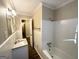 Clean bathroom with white tile, granite vanity and bathtub at 2798 Engle Nw Rd, Atlanta, GA 30318