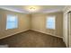 Spacious bedroom with carpet, neutral walls and two windows at 2798 Engle Nw Rd, Atlanta, GA 30318