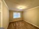 Well-lit bedroom with neutral walls and carpet flooring at 2798 Engle Nw Rd, Atlanta, GA 30318