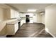 Modern kitchen with white cabinets, granite countertops, and stainless steel appliances at 2798 Engle Nw Rd, Atlanta, GA 30318
