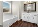 Bathroom with soaking tub and vanity at 11602 Kades Trl, Hampton, GA 30228