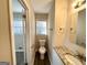 Small bathroom with granite vanity, toilet and window at 3568 Glenview Cir, Atlanta, GA 30331