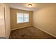 Simple bedroom with carpet flooring and a window with blinds at 3568 Glenview Cir, Atlanta, GA 30331