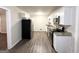 Modern kitchen with white cabinets, granite counters, and stainless steel appliances at 3568 Glenview Cir, Atlanta, GA 30331