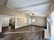 Living room with hardwood floors, exposed beams, and a fireplace at 3568 Glenview Cir, Atlanta, GA 30331