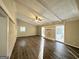 Spacious living area with hardwood floors, exposed beams, and a fireplace at 3568 Glenview Cir, Atlanta, GA 30331