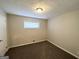 Simple bedroom with neutral wall color and brown carpet at 2302 Montrose Dr, East Point, GA 30344