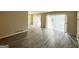Living room with grey laminate flooring and sliding glass doors at 2302 Montrose Dr, East Point, GA 30344