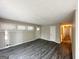 Spacious living room with grey flooring and access to other rooms at 2302 Montrose Dr, East Point, GA 30344