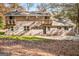 Rear view of brick house with balconies at 425 Meadowbrook Dr, Mcdonough, GA 30253