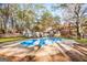 Aerial view of kidney-shaped pool and house at 425 Meadowbrook Dr, Mcdonough, GA 30253