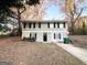 Two-story house with gray siding, landscaping, and a paved driveway at 2852 Port Royal Ln, Decatur, GA 30034