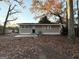 Gray house exterior with a concrete patio and landscaping at 2852 Port Royal Ln, Decatur, GA 30034