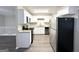Modern kitchen with white cabinets, granite countertops, and stainless steel appliances at 2852 Port Royal Ln, Decatur, GA 30034